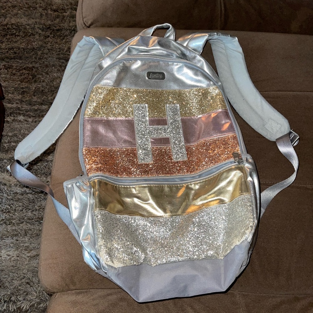 Metallic gold silver and rose gold justice backpack
